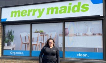 Franchise of the year winner Stephanie Applejohn standing in front of her storefront